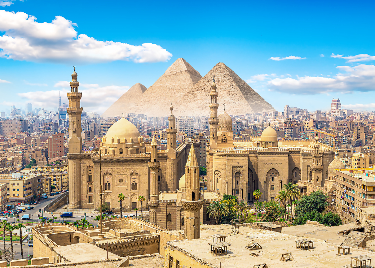 View of the Mosque Sultan Hassan in Cairo and pyramids